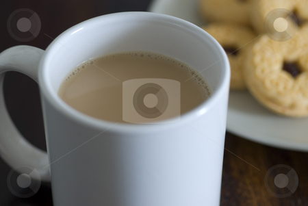 To use this stock image in your creative project, please select the size you need over to the right and click the "Add to Cart" button.
Your downloaded image will come with the Cutcaster watermark removed so don’t worry about the watermark you see on this page. Tea and biscuits stock photo, A mug of white tea and plate jam biscuits by Stephen Gibson
