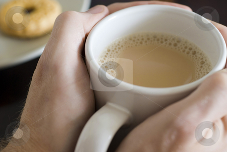 To use this stock image in your creative project, please select the size you need over to the right and click the "Add to Cart" button.
Your downloaded image will come with the Cutcaster watermark removed so don’t worry about the watermark you see on this page. Warming hands stock photo, Warming hands on a large mug of white tea by Stephen Gibson