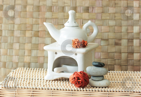 To use this stock image in your creative project, please select the size you need over to the right and click the "Add to Cart" button.
Your downloaded image will come with the Cutcaster watermark removed so don’t worry about the watermark you see on this page. Aroma set stock photo, Fragrance lamp for meditation with dry aromatic flowers of orange color and a pile of zen stones by Natalia Macheda