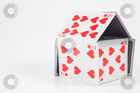 To use this stock image in your creative project, please select the size you need over to the right and click the "Add to Cart" button.
Your downloaded image will come with the Cutcaster watermark removed so don’t worry about the watermark you see on this page. House of Cards stock photo, A house made out of playing cards. by Robert Byron
