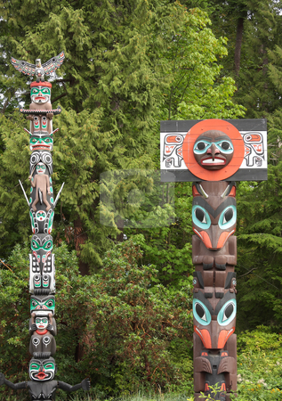 To use this stock image in your creative project, please select the size you need over to the right and click the "Add to Cart" button.
Your downloaded image will come with the Cutcaster watermark removed so don’t worry about the watermark you see on this page. Historic Totem Poles stock photo, A pair of historic totem poles in Stanley Park, Vancouver Canada. by Steve Stedman