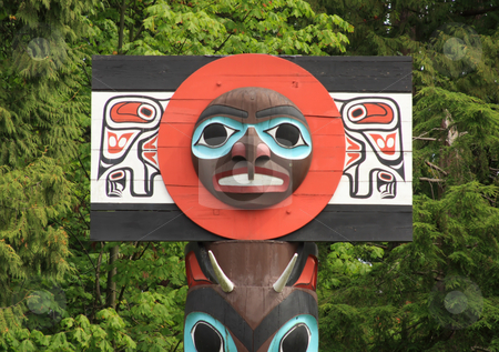 To use this stock image in your creative project, please select the size you need over to the right and click the "Add to Cart" button.
Your downloaded image will come with the Cutcaster watermark removed so don’t worry about the watermark you see on this page. Historic Totem Pole stock photo, Carved face on a historic totem pole by ancient native people in Stanley Park, Vancouver, British Columbia, Canada. by Steve Stedman
