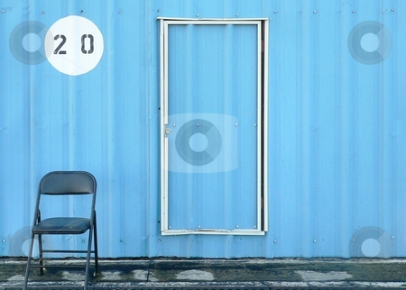 To use this stock image in your creative project, please select the size you need over to the right and click the "Add to Cart" button.
Your downloaded image will come with the Cutcaster watermark removed so don’t worry about the watermark you see on this page. Chair and Door stock photo, Empty chair sitting next to closed door with building number above by Perry Correll