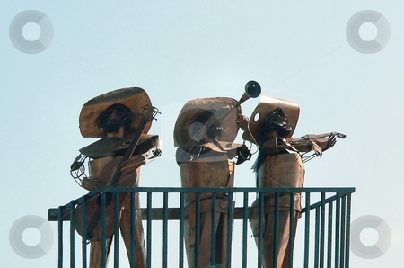 To use this stock image in your creative project, please select the size you need over to the right and click the "Add to Cart" button.
Your downloaded image will come with the Cutcaster watermark removed so don’t worry about the watermark you see on this page. Mariachi statues stock photo, Outdoor bronze statue of mariachi band by Perry Correll