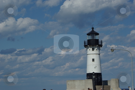 To use this stock image in your creative project, please select the size you need over to the right and click the "Add to Cart" button.
Your downloaded image will come with the Cutcaster watermark removed so don’t worry about the watermark you see on this page. Lake Superior Lighthouse stock photo, This black and whilte Duluth, Minnesota lighthouse is one of two lighthouses marking the opening to the canal entry of the Duluth harbor on Lake Superior. The old lighthouse is no longer in operation, but it is a popular tourist attraction in Duluth's Canal Park. by Dennis Thomsen
