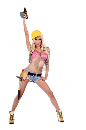 To use this stock image in your creative project, please select the size you need over to the right and click the "Add to Cart" button.
Your downloaded image will come with the Cutcaster watermark removed so don’t worry about the watermark you see on this page. Sexy Construction Worker stock photo, High fashion glamour model in daisy duke shorts, tool belt, pink bra and yellow hard hat on a ladder with a screw gun by Robert Deal