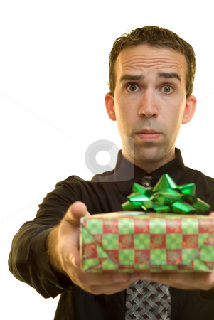 To use this stock image in your creative project, please select the size you need over to the right and click the "Add to Cart" button.
Your downloaded image will come with the Cutcaster watermark removed so don’t worry about the watermark you see on this page. Corporate Christmas stock photo, A young businessman holding out a Christmas present to someone by Richard Nelson