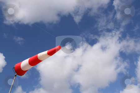 To use this stock image in your creative project, please select the size you need over to the right and click the "Add to Cart" button.
Your downloaded image will come with the Cutcaster watermark removed so don’t worry about the watermark you see on this page. Windsock (horizontal) stock photo, Red and white windsock blows against a blue sky by Tilo