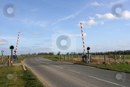 To use this stock image in your creative project, please select the size you need over to the right and click the "Add to Cart" button.
Your downloaded image will come with the Cutcaster watermark removed so don’t worry about the watermark you see on this page. Railroad crossing stock photo, Railway level crossing in the country by Tilo