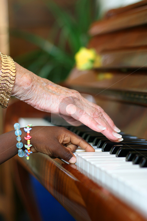 To use this stock image in your creative project, please select the size you need over to the right and click the "Add to Cart" button.
Your downloaded image will come with the Cutcaster watermark removed so don’t worry about the watermark you see on this page. Ebony and Ivory Harmony stock photo, One older white hand and one younger black hand playing the piano by Tilo
