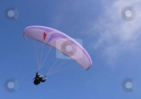 To use this stock image in your creative project, please select the size you need over to the right and click the "Add to Cart" button.
Your downloaded image will come with the Cutcaster watermark removed so don’t worry about the watermark you see on this page. Purple paraglider stock photo, Purple paraglider flying by Tilo