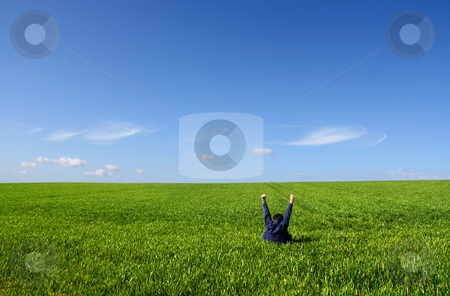 To use this stock image in your creative project, please select the size you need over to the right and click the "Add to Cart" button.
Your downloaded image will come with the Cutcaster watermark removed so don’t worry about the watermark you see on this page. Self victory stock photo, A man sitting alone in a green field, with lifted V arms by Tilo