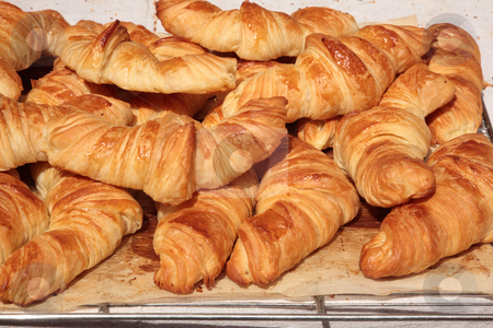 To use this stock image in your creative project, please select the size you need over to the right and click the "Add to Cart" button.
Your downloaded image will come with the Cutcaster watermark removed so don’t worry about the watermark you see on this page. Croissants stock photo, Croissants in the shop by Tilo