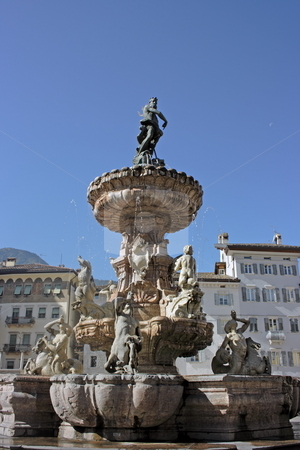 To use this stock image in your creative project, please select the size you need over to the right and click the "Add to Cart" button.
Your downloaded image will come with the Cutcaster watermark removed so don’t worry about the watermark you see on this page. Nettuno di Trento stock photo, The main square (piazza Duomo) of Trento (Italy) with a fountain as Neptune holding a trident. Anciet buildings are on the background by Natalia Macheda