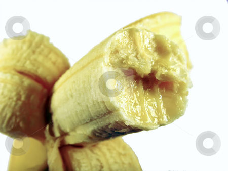 To use this stock image in your creative project, please select the size you need over to the right and click the "Add to Cart" button.
Your downloaded image will come with the Cutcaster watermark removed so don’t worry about the watermark you see on this page. Bitten banana stock photo, A close up of a bitten banana over white by Ivan Paunovic