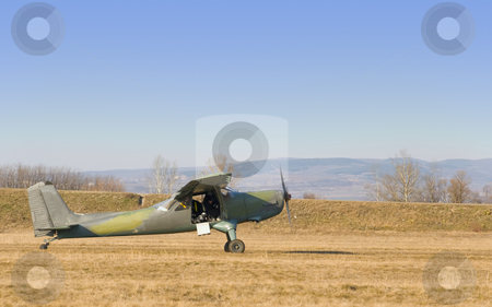 To use this stock image in your creative project, please select the size you need over to the right and click the "Add to Cart" button.
Your downloaded image will come with the Cutcaster watermark removed so don’t worry about the watermark you see on this page. Old plane stock photo, An old plane is preparing to fly by Ivan Paunovic