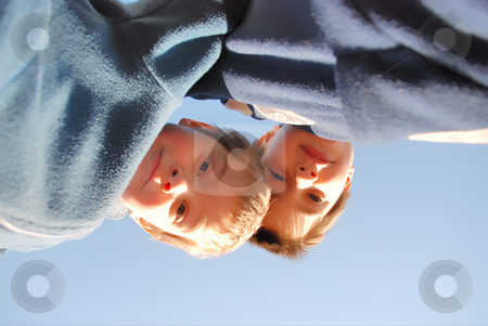 To use this stock image in your creative project, please select the size you need over to the right and click the "Add to Cart" button.
Your downloaded image will come with the Cutcaster watermark removed so don’t worry about the watermark you see on this page. Boys looking down stock photo, Two boys play outside. They are looking down at us and we are on the ground by Ivan Paunovic