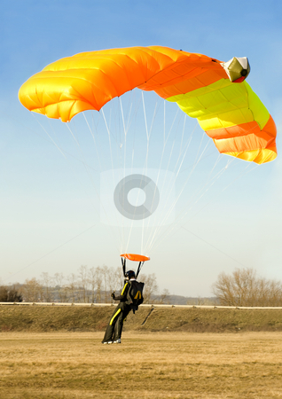 To use this stock image in your creative project, please select the size you need over to the right and click the "Add to Cart" button.
Your downloaded image will come with the Cutcaster watermark removed so don’t worry about the watermark you see on this page. Orange parachute stock photo, An orange parachute is landing softly on a sunny day by Ivan Paunovic