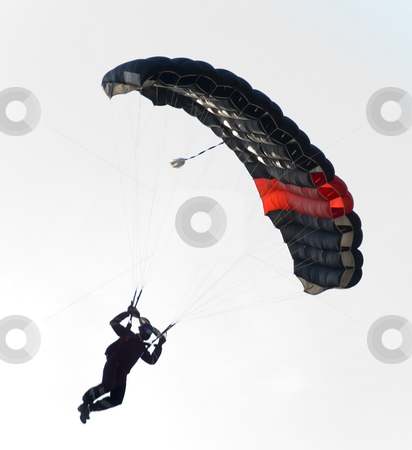 To use this stock image in your creative project, please select the size you need over to the right and click the "Add to Cart" button.
Your downloaded image will come with the Cutcaster watermark removed so don’t worry about the watermark you see on this page. Black parachute stock photo, A black parachute in a skylight. the sun is almost behind it by Ivan Paunovic