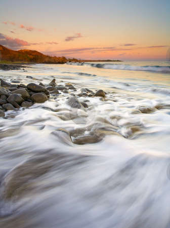 To use this stock image in your creative project, please select the size you need over to the right and click the "Add to Cart" button.
Your downloaded image will come with the Cutcaster watermark removed so don’t worry about the watermark you see on this page. Sunset Tides stock photo, Tides rolling shore as the sun sets over a rocky beach near Lahaina on Maui. by Mike Dawson