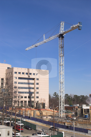 To use this stock image in your creative project, please select the size you need over to the right and click the "Add to Cart" button.
Your downloaded image will come with the Cutcaster watermark removed so don’t worry about the watermark you see on this page. Giant Crane stock photo, A giant crane on a busy construction site. by Robert Byron