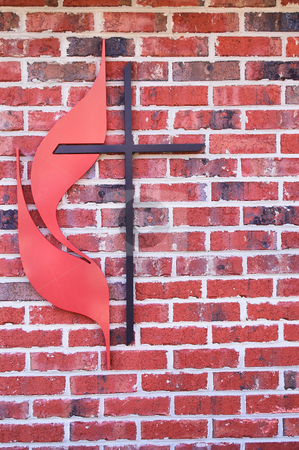 To use this stock image in your creative project, please select the size you need over to the right and click the "Add to Cart" button.
Your downloaded image will come with the Cutcaster watermark removed so don’t worry about the watermark you see on this page. Cross stock photo, A Christian cross on the side of a building. by Robert Byron