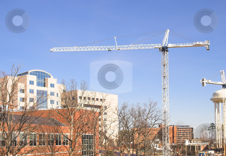 To use this stock image in your creative project, please select the size you need over to the right and click the "Add to Cart" button.
Your downloaded image will come with the Cutcaster watermark removed so don’t worry about the watermark you see on this page. Giant Crane stock photo, A giant crane on a busy construction site. by Robert Byron