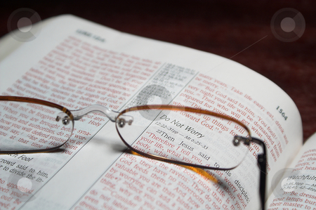 To use this stock image in your creative project, please select the size you need over to the right and click the "Add to Cart" button.
Your downloaded image will come with the Cutcaster watermark removed so don’t worry about the watermark you see on this page. Bible Verse stock photo, Scriprure verses inside of a holy bible and reading glasses. by Robert Byron