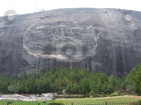 To use this stock image in your creative project, please select the size you need over to the right and click the "Add to Cart" button.
Your downloaded image will come with the Cutcaster watermark removed so don’t worry about the watermark you see on this page. Stone Mountain stock photo, A clear shot of Stone Mountain's Carving in Atlanta Georgia. by David Robinson