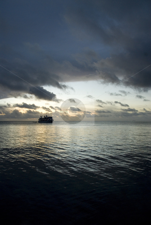 To use this stock image in your creative project, please select the size you need over to the right and click the "Add to Cart" button.
Your downloaded image will come with the Cutcaster watermark removed so don’t worry about the watermark you see on this page. Boat at Sunset stock photo, Boat on the cloudy sunset in Micronesia by A Cotton Photo