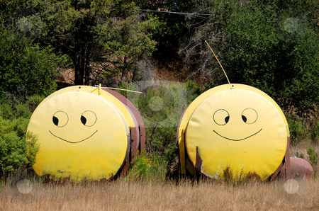 To use this stock image in your creative project, please select the size you need over to the right and click the "Add to Cart" button.
Your downloaded image will come with the Cutcaster watermark removed so don’t worry about the watermark you see on this page. Smiley Face Tanks stock photo, Two Tanks with Yellow Smiley Faces Painted on Them Standing Next to Each Other in a Field by Denis Radovanovic