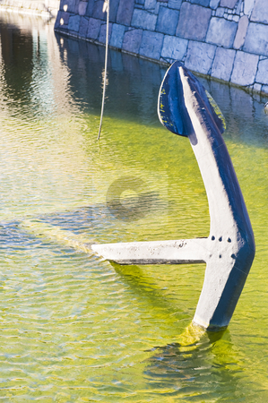 To use this stock image in your creative project, please select the size you need over to the right and click the "Add to Cart" button.
Your downloaded image will come with the Cutcaster watermark removed so don’t worry about the watermark you see on this page. Old large anchor in shallow water stock photo, An old large anchor lying in shallow water at the docks. by Nicolaas Traut