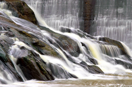 To use this stock image in your creative project, please select the size you need over to the right and click the "Add to Cart" button.
Your downloaded image will come with the Cutcaster watermark removed so don’t worry about the watermark you see on this page. Waterfall stock photo, Water flowing over natural rock formations to form a waterfall. by Robert Byron