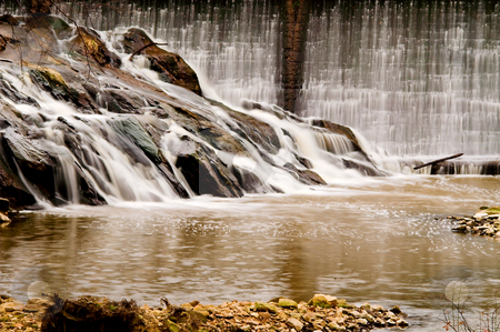 To use this stock image in your creative project, please select the size you need over to the right and click the "Add to Cart" button.
Your downloaded image will come with the Cutcaster watermark removed so don’t worry about the watermark you see on this page. Waterfall stock photo, A stream pouring over a formation of rocks. by Robert Byron