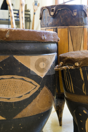 To use this stock image in your creative project, please select the size you need over to the right and click the "Add to Cart" button.
Your downloaded image will come with the Cutcaster watermark removed so don’t worry about the watermark you see on this page. Selection of African drums stock photo, A selection of ornate African drums made of wood and animal skin. by Nicolaas Traut