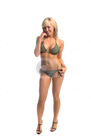 To use this stock image in your creative project, please select the size you need over to the right and click the "Add to Cart" button.
Your downloaded image will come with the Cutcaster watermark removed so don’t worry about the watermark you see on this page. Green Embellished Bikini Blond stock photo, Sexy blond swimwear model in a green bikini embellished with gold thread embroidery, beads and sequines. Full body with finger to the corner of the mouth by Robert Deal