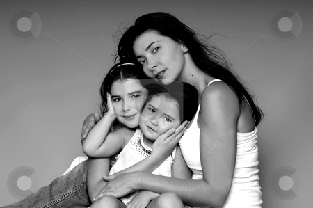 To use this stock image in your creative project, please select the size you need over to the right and click the "Add to Cart" button.
Your downloaded image will come with the Cutcaster watermark removed so don’t worry about the watermark you see on this page. We are Family stock photo, A mother and her two young daughters in a formal portrait by Robert Deal