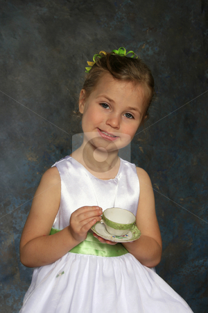 To use this stock image in your creative project, please select the size you need over to the right and click the "Add to Cart" button.
Your downloaded image will come with the Cutcaster watermark removed so don’t worry about the watermark you see on this page. Tea party stock photo, Cute little girl all dressed up holding a tea cup and saucer by Anita Peppers
