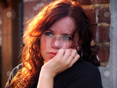 To use this stock image in your creative project, please select the size you need over to the right and click the "Add to Cart" button.
Your downloaded image will come with the Cutcaster watermark removed so don’t worry about the watermark you see on this page. Sadness stock photo, Portrait of a young woman with sunlit hair and sad expression by Anita Peppers