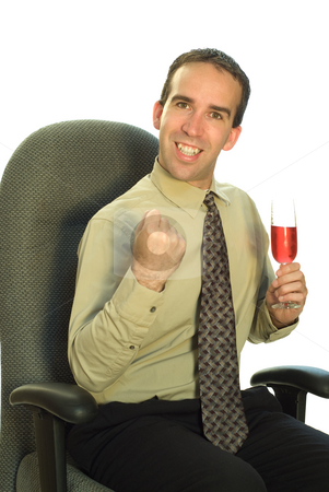 To use this stock image in your creative project, please select the size you need over to the right and click the "Add to Cart" button.
Your downloaded image will come with the Cutcaster watermark removed so don’t worry about the watermark you see on this page. Business Celebration stock photo, A young businessman looking excited and holding a glass of wine by Richard Nelson