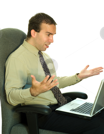 To use this stock image in your creative project, please select the size you need over to the right and click the "Add to Cart" button.
Your downloaded image will come with the Cutcaster watermark removed so don’t worry about the watermark you see on this page. Work Frustration stock photo, A young businessman sitting in his chair, getting mad at the laptop by Richard Nelson