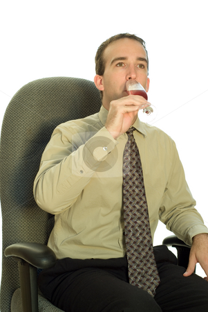 To use this stock image in your creative project, please select the size you need over to the right and click the "Add to Cart" button.
Your downloaded image will come with the Cutcaster watermark removed so don’t worry about the watermark you see on this page. Businessman Drinking Wine stock photo, A young businessman drinking red wine while sitting in his chair by Richard Nelson