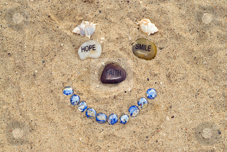 To use this stock image in your creative project, please select the size you need over to the right and click the "Add to Cart" button.
Your downloaded image will come with the Cutcaster watermark removed so don’t worry about the watermark you see on this page. Face In The Sand stock photo, A happy face made with stones and seashells by Richard Nelson