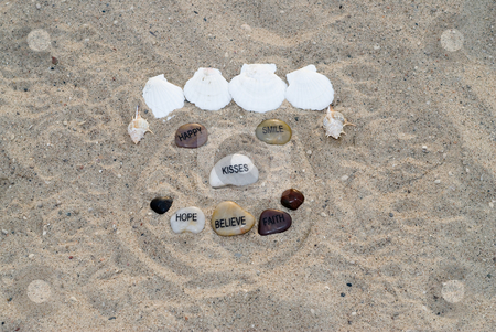 To use this stock image in your creative project, please select the size you need over to the right and click the "Add to Cart" button.
Your downloaded image will come with the Cutcaster watermark removed so don’t worry about the watermark you see on this page. Happy Face stock photo, A happy face made with assorted seashells by Richard Nelson