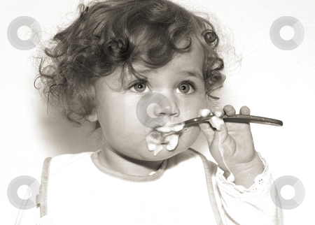 To use this stock image in your creative project, please select the size you need over to the right and click the "Add to Cart" button.
Your downloaded image will come with the Cutcaster watermark removed so don’t worry about the watermark you see on this page. Baby with spoon stock photo, Vintage style black and white of a messy baby eating with a spoon by Anita Peppers