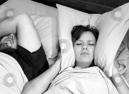 To use this stock image in your creative project, please select the size you need over to the right and click the "Add to Cart" button.
Your downloaded image will come with the Cutcaster watermark removed so don’t worry about the watermark you see on this page. Snoring stock photo, Couple in bed with woman trying to sleep with man snoring by Anita Peppers
