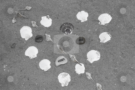 To use this stock image in your creative project, please select the size you need over to the right and click the "Add to Cart" button.
Your downloaded image will come with the Cutcaster watermark removed so don’t worry about the watermark you see on this page. Heart Shape stock photo, A heart with an arrow made from assorted seashells by Richard Nelson