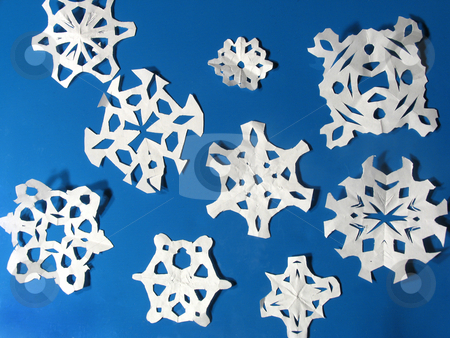 To use this stock image in your creative project, please select the size you need over to the right and click the "Add to Cart" button.
Your downloaded image will come with the Cutcaster watermark removed so don’t worry about the watermark you see on this page. Snowflakes stock photo, Children's paper snowflake cut-outs against a blue background by Anita Peppers