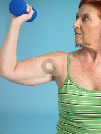 To use this stock image in your creative project, please select the size you need over to the right and click the "Add to Cart" button.
Your downloaded image will come with the Cutcaster watermark removed so don’t worry about the watermark you see on this page. Woman with dumbbell exercising stock photo, Senior woman lifting a dumbbell by Mpixis World