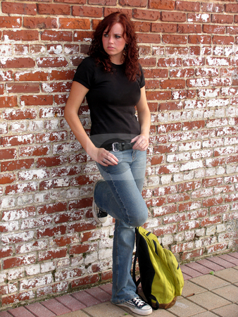 To use this stock image in your creative project, please select the size you need over to the right and click the "Add to Cart" button.
Your downloaded image will come with the Cutcaster watermark removed so don’t worry about the watermark you see on this page. Waiting stock photo, Young woman standing against a brick wall by Anita Peppers